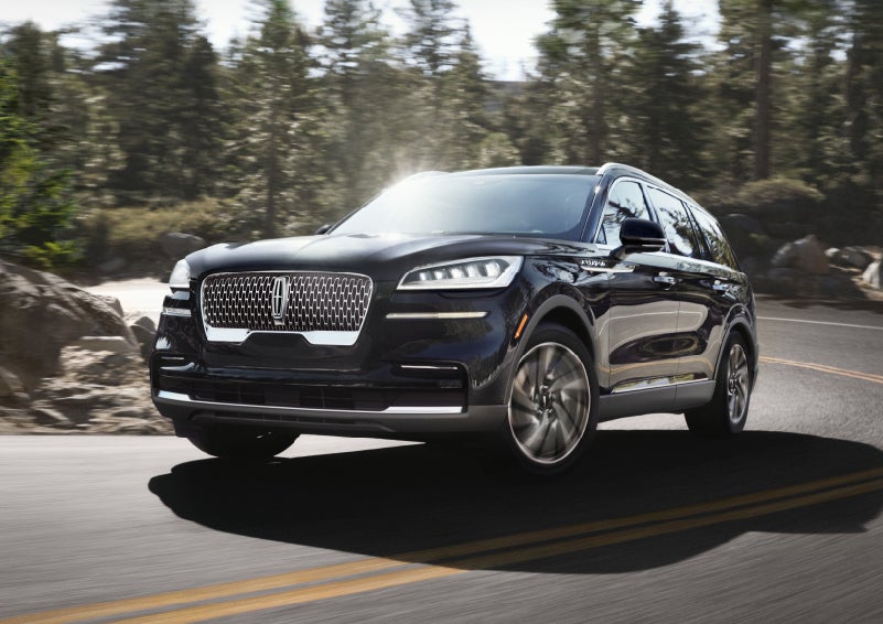 A Lincoln Aviator® SUV is being driven on a winding mountain road | Dutch Miller Lincoln of Ashland in Ashland KY