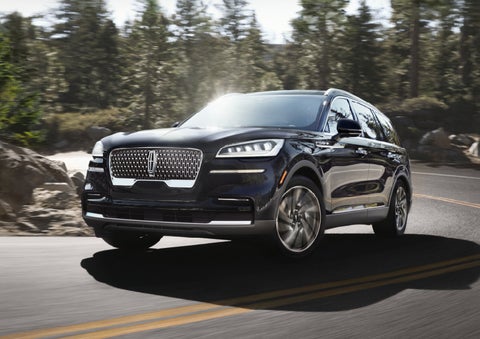 A Lincoln Aviator® SUV is being driven on a winding mountain road | Dutch Miller Lincoln of Ashland in Ashland KY