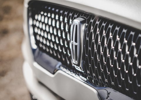 The grille of the 2024 Lincoln Aviator® Reserve model with an eye-catching repeated field of Lincoln Star logo shapes | Dutch Miller Lincoln of Ashland in Ashland KY