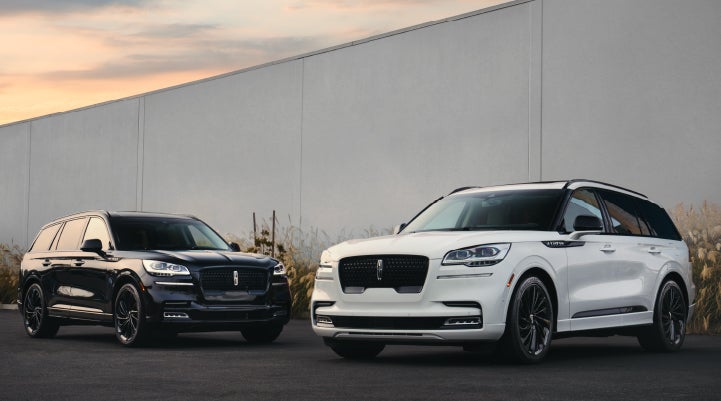 Two Lincoln Aviator® SUVs are shown with the available Jet Appearance Package | Dutch Miller Lincoln of Ashland in Ashland KY