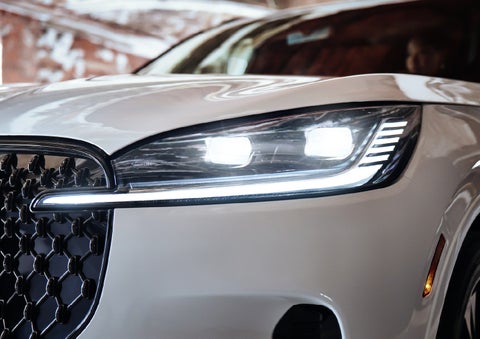A close-up of a headlamp on the 2027 Lincoln Aviator® SUV is shown. | Dutch Miller Lincoln of Ashland in Ashland KY