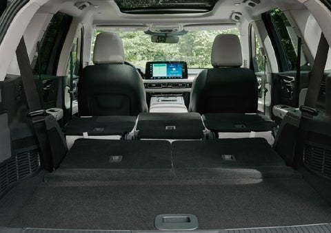 A rear to front view of the interior of a 2027 Lincoln Aviator® Black Label™ SUV shows the third and second rows folded flat | Dutch Miller Lincoln of Ashland in Ashland KY